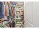 Well-organized closet space with shelving and ample storage for clothing and accessories at 5659 Augusta Woods Dr, Plainfield, IN 46168