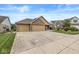 Attractive single-Gathering home with a three-car garage, brick exterior, and well-maintained lawn at 5659 Augusta Woods Dr, Plainfield, IN 46168