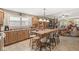 Open kitchen features an island with seating and lots of counter space at 5659 Augusta Woods Dr, Plainfield, IN 46168