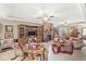 Cozy living room boasts a brick fireplace, built-in entertainment center, and lots of space at 5659 Augusta Woods Dr, Plainfield, IN 46168