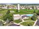 This beautiful aerial shot captures the pool and playground nestled within a well-maintained community at 5765 White Pine Rd, Whitestown, IN 46075