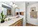 Bathroom featuring double sinks, a large mirror, and a walk-in shower at 5765 White Pine Rd, Whitestown, IN 46075