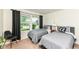 Bedroom featuring two twin beds, a large window, and chair at 5765 White Pine Rd, Whitestown, IN 46075