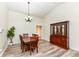 Formal dining room features a large wooden table, vaulted ceilings, and ample space for entertaining guests at 5765 White Pine Rd, Whitestown, IN 46075