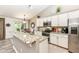 Well-equipped kitchen featuring granite countertops, stainless steel appliances, and custom cabinetry at 5765 White Pine Rd, Whitestown, IN 46075