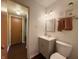 Bathroom with gray vanity and modern mirror, with convenient access to the hallway at 5965 Deerwood Ct, Indianapolis, IN 46254