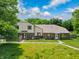 Charming home featuring a lush green lawn and sidewalks leading to inviting entrances at 5965 Deerwood Ct, Indianapolis, IN 46254