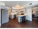 Bright kitchen features stainless steel appliances, light gray cabinets, and a breakfast bar with seating at 5965 Deerwood Ct, Indianapolis, IN 46254