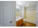 This bathroom features a shower-tub combo, wood-style flooring, and single sink vanity at 6029 Sycamore Forge Dr, Indianapolis, IN 46254
