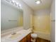 Bathroom with a shower-tub combo, wooden cabinets, and a single sink vanity at 6029 Sycamore Forge Dr, Indianapolis, IN 46254