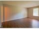 Bright bedroom with new flooring and a window letting in plenty of natural light at 6029 Sycamore Forge Dr, Indianapolis, IN 46254