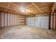 Spacious unfinished garage with two-car door, perfect for parking and storage at 6029 Sycamore Forge Dr, Indianapolis, IN 46254