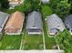 An aerial view of the home's neighborhood with mature trees and well-manicured lawns at 615 Udell St, Indianapolis, IN 46208