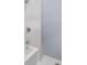 This bathroom features a shower and tub combo with a white tile surround at 615 Udell St, Indianapolis, IN 46208