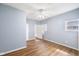 Bedroom with hardwood floors, ceiling fan, and natural light at 615 Udell St, Indianapolis, IN 46208