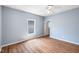 Cozy bedroom with ceiling fan, ample natural light, and wood-look flooring at 615 Udell St, Indianapolis, IN 46208