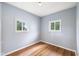 Bedroom with windows providing plenty of natural light and hardwood floors at 615 Udell St, Indianapolis, IN 46208