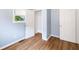 Bedroom with walk-in closet, hardwood floors, and natural light from the window at 615 Udell St, Indianapolis, IN 46208