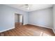 Inviting bedroom with hardwood floors and neutral walls with a ceiling fan at 615 Udell St, Indianapolis, IN 46208