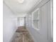 A view of the home's light and airy entryway with wood ceilings and large windows at 615 Udell St, Indianapolis, IN 46208