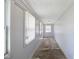 A view of the home's bright and airy entryway with wood ceilings and large windows at 615 Udell St, Indianapolis, IN 46208