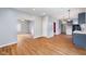 Open-concept living room with wood floors and neutral paint; flows to kitchen at 615 Udell St, Indianapolis, IN 46208