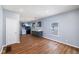 Bright living area with hardwood floors, open layout, and view of modern kitchen at 615 Udell St, Indianapolis, IN 46208
