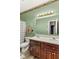 Bright bathroom featuring a double sink vanity, good lighting, and a shower-tub combination at 619 Cahill Ln, Indianapolis, IN 46214