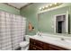 A bathroom featuring a double sink vanity, updated fixtures, and a shower-tub combination at 619 Cahill Ln, Indianapolis, IN 46214