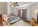 A well-lit bedroom with neutral tones, offers a comfortable and relaxing retreat at 619 Cahill Ln, Indianapolis, IN 46214