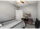 Comfortable bedroom with soft gray walls, ceiling fan, and carpet, a haven for rest and relaxation at 619 Cahill Ln, Indianapolis, IN 46214