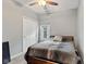 Cozy bedroom with neutral walls, a ceiling fan, and plush carpeting, creating a peaceful retreat at 619 Cahill Ln, Indianapolis, IN 46214