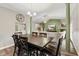 An open dining room with seating for six flows seamlessly into the adjacent living space at 619 Cahill Ln, Indianapolis, IN 46214
