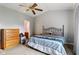 A cozy bedroom with a metal-framed bed and simple decor offers a comfortable and inviting space at 619 Cahill Ln, Indianapolis, IN 46214