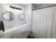 Bright bathroom with a double vanity, modern fixtures, and a shower-tub combo at 740 Springmill Dr, Mooresville, IN 46158