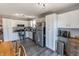 Bright kitchen featuring stainless steel appliances, white cabinets, and a view of the breakfast nook at 740 Springmill Dr, Mooresville, IN 46158