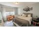 Serene main bedroom features light-colored walls, a large window, and comfortable furnishings at 740 Springmill Dr, Mooresville, IN 46158