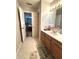 Bathroom featuring a tiled floor and wood vanity at 8425 Brook Pointe Ct, Indianapolis, IN 46234