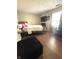 Bedroom featuring wood floors, neutral walls, and wall-mounted TV at 8425 Brook Pointe Ct, Indianapolis, IN 46234