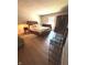 Bedroom with wood floors, neutral walls, and furniture at 8425 Brook Pointe Ct, Indianapolis, IN 46234