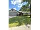 Charming single-story home with well-maintained lawn and mature trees on a sunny day at 8425 Brook Pointe Ct, Indianapolis, IN 46234