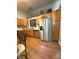 Spacious kitchen with stainless steel appliances, wooden cabinets, and hardwood floors at 8425 Brook Pointe Ct, Indianapolis, IN 46234