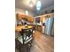Well-lit kitchen with stainless steel appliances, wooden cabinets, and breakfast table at 8425 Brook Pointe Ct, Indianapolis, IN 46234