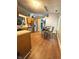 Kitchen and eating area showcasing stainless steel appliances and wood flooring at 8425 Brook Pointe Ct, Indianapolis, IN 46234