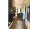 Inviting living room view with hardwood floors and a brick fireplace at 8425 Brook Pointe Ct, Indianapolis, IN 46234
