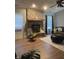 Comfortable living area with brick fireplace, hardwood floors, and lots of natural light at 8425 Brook Pointe Ct, Indianapolis, IN 46234