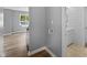 Bright bathroom featuring marble floors, shiplap walls, and a white vanity with a modern sink at 9319 Rochelle Dr, Indianapolis, IN 46235