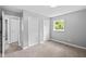 Bedroom with neutral carpet, window, and two closets at 9319 Rochelle Dr, Indianapolis, IN 46235