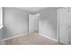 Bedroom with neutral carpet, closet and view of an adjoining room at 9319 Rochelle Dr, Indianapolis, IN 46235