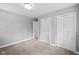 Bedroom with neutral carpet, and two closets providing ample storage space at 9319 Rochelle Dr, Indianapolis, IN 46235